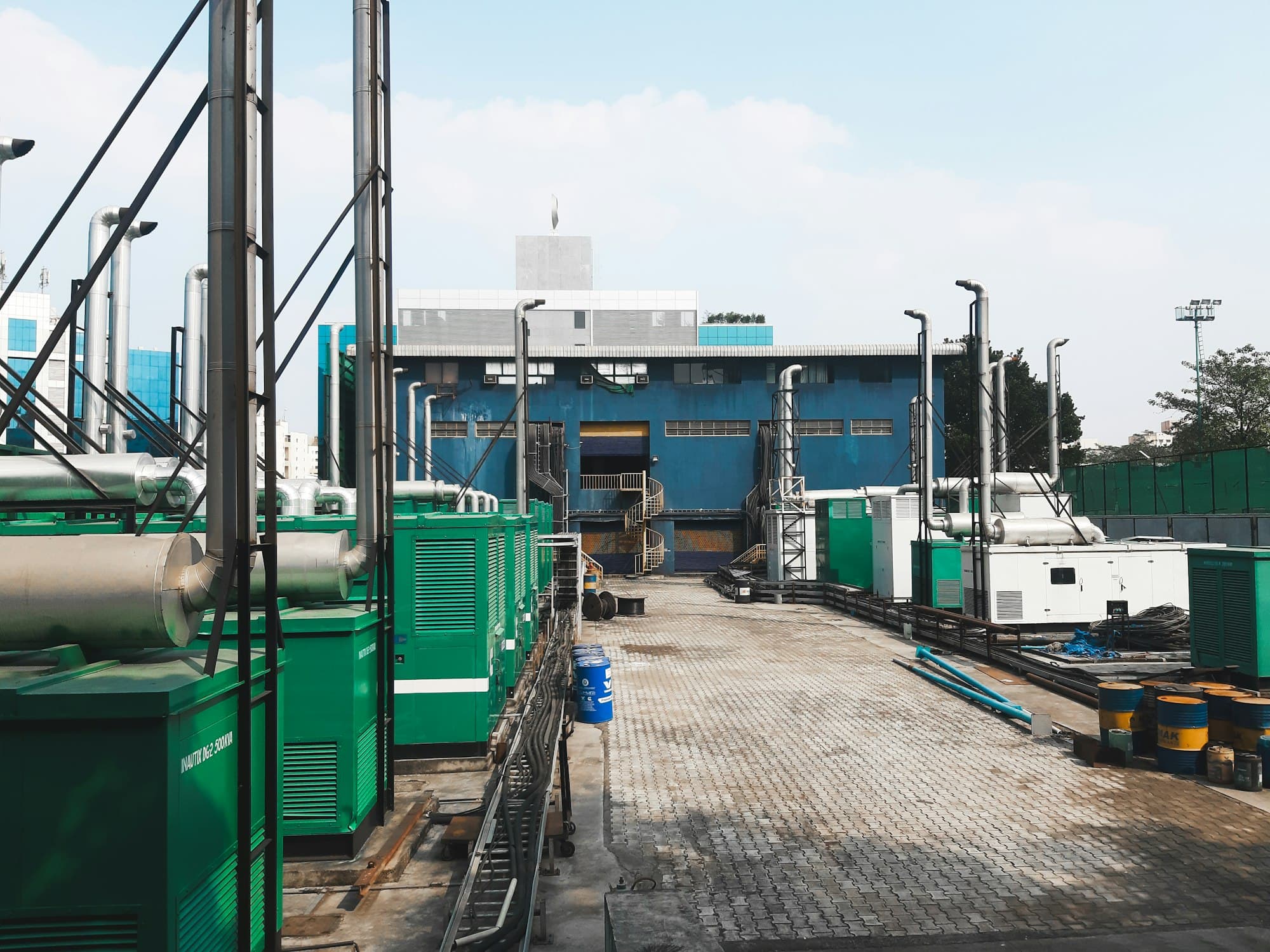 Row of industrial generator sets installed at a power facility